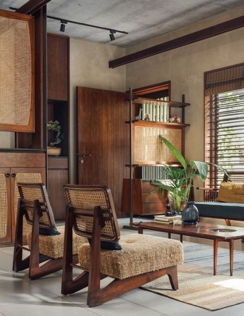 Chandigarh style living room interior with cane armchairs
